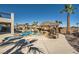 Inviting backyard pool with rock features, grotto bar, and lush landscaping provides an ideal outdoor retreat at 3892 Pasilla Ave, Las Vegas, NV 89118