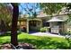 Spacious backyard with a covered patio, BBQ grill, and well-maintained landscaping at 4047 Cougar Falls Ct, North Las Vegas, NV 89085