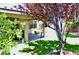 Relaxing backyard patio with comfortable seating and a lush lawn, perfect for outdoor living at 4047 Cougar Falls Ct, North Las Vegas, NV 89085