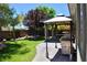 Serene backyard featuring a covered patio and barbecue area at 4047 Cougar Falls Ct, North Las Vegas, NV 89085