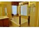 A clean bathroom features a tub, shower, neutral decor, and tile accents at 4047 Cougar Falls Ct, North Las Vegas, NV 89085