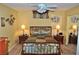 Cozy bedroom with decorative lamps, a ceiling fan, and a wrought iron bed frame at 4047 Cougar Falls Ct, North Las Vegas, NV 89085