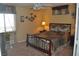 Bedroom with a wrought iron bed frame, side tables, and a ceiling fan at 4047 Cougar Falls Ct, North Las Vegas, NV 89085