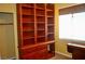 Spacious home office with custom wooden built-ins, desk space, and great natural light at 4047 Cougar Falls Ct, North Las Vegas, NV 89085