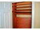An open door reveals a custom built-in closet with shelves and drawers for storage at 4047 Cougar Falls Ct, North Las Vegas, NV 89085
