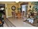 Inviting dining area featuring a wooden table with seating for six and decorative accents at 4047 Cougar Falls Ct, North Las Vegas, NV 89085