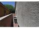 Exterior view of home with stucco wall and AC unit at 4047 Cougar Falls Ct, North Las Vegas, NV 89085
