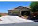 Charming single-story home featuring a three-car garage and well-maintained landscaping at 4047 Cougar Falls Ct, North Las Vegas, NV 89085