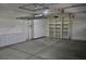 An organized garage featuring built-in storage cabinets and shelving for tools and equipment at 4047 Cougar Falls Ct, North Las Vegas, NV 89085