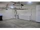 A spacious two car garage features storage, shelving, and a water softening system at 4047 Cougar Falls Ct, North Las Vegas, NV 89085