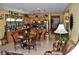 Open kitchen and living area with tile flooring, and dining area at 4047 Cougar Falls Ct, North Las Vegas, NV 89085