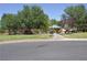 Picturesque neighborhood park with mature trees, playground equipment, and walking paths at 4047 Cougar Falls Ct, North Las Vegas, NV 89085