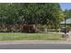 Community playground with mature shade trees and picnic tables for residents' enjoyment and outdoor activities at 4047 Cougar Falls Ct, North Las Vegas, NV 89085