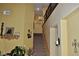 View of the staircase with a decorative wall sconce, wall art, and a sign for the billiard room at 4047 Cougar Falls Ct, North Las Vegas, NV 89085