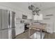 Bright kitchen featuring stainless steel appliances, white cabinets, and butcher block island at 413 Pumpkin Way, Henderson, NV 89015