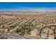 Expansive aerial view of a residential community with mountain views, showcasing the neighborhood's layout at 4384 Grey Spencer Dr, Las Vegas, NV 89141