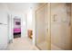 Bathroom featuring glass shower doors and a view into the connected bedroom at 4384 Grey Spencer Dr, Las Vegas, NV 89141