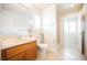 Bathroom featuring a wood vanity, toilet, and glass shower with tile at 4384 Grey Spencer Dr, Las Vegas, NV 89141