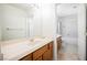 Bathroom featuring a wood vanity and a view into the toilet and shower at 4384 Grey Spencer Dr, Las Vegas, NV 89141