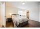 Bedroom featuring hardwood floors and striped bedding at 4384 Grey Spencer Dr, Las Vegas, NV 89141