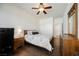 Bright bedroom features hardwood floors, ceiling fan, and neutral colors, providing a peaceful retreat at 4384 Grey Spencer Dr, Las Vegas, NV 89141