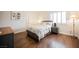 Bedroom featuring hardwood floors and striped bedding at 4384 Grey Spencer Dr, Las Vegas, NV 89141
