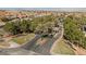 Elegant community entrance with lush landscaping, mature palm trees, and decorative signage at 4384 Grey Spencer Dr, Las Vegas, NV 89141