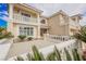 Close up of a two-story home with detailed entrance and manicured landscaping at 4384 Grey Spencer Dr, Las Vegas, NV 89141