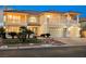 Beautiful two-story home with a tile roof, three-car garage, and landscaped yard at 4384 Grey Spencer Dr, Las Vegas, NV 89141