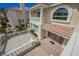 Inviting two-story home with a tile roof, balcony, and manicured landscaping at 4384 Grey Spencer Dr, Las Vegas, NV 89141