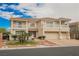 Spacious two-story home with a three-car garage, tile roof, and manicured front yard at 4384 Grey Spencer Dr, Las Vegas, NV 89141
