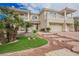 Elegant two-story home with a tile roof, three-car garage, and well-maintained landscaping at 4384 Grey Spencer Dr, Las Vegas, NV 89141