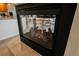 Modern fireplace encased in black trim and tile at 4384 Grey Spencer Dr, Las Vegas, NV 89141