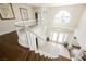 Bright foyer with chandelier and curved staircase leading to the home's entrance at 4384 Grey Spencer Dr, Las Vegas, NV 89141