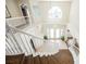 Bright foyer features a chandelier, double doors, and curved staircase at 4384 Grey Spencer Dr, Las Vegas, NV 89141