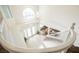 Elegant foyer with a chandelier, double doors, and curved staircase at 4384 Grey Spencer Dr, Las Vegas, NV 89141