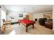 Large game room with a red pool table, desk and treadmill for recreation and fitness at 4384 Grey Spencer Dr, Las Vegas, NV 89141