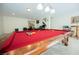 Inviting game room features a pool table and an office area in a well-lit, spacious environment at 4384 Grey Spencer Dr, Las Vegas, NV 89141