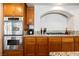 Kitchen with stainless steel appliances, granite countertops, and custom wood cabinets at 4384 Grey Spencer Dr, Las Vegas, NV 89141