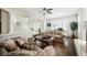Open-concept living room with hardwood floors, a fireplace, and a staircase in view at 4384 Grey Spencer Dr, Las Vegas, NV 89141