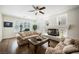 Inviting living room featuring a fireplace, hardwood floors, and plantation shutters at 4384 Grey Spencer Dr, Las Vegas, NV 89141
