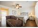 Well lit main bedroom with hardwood floors and a comfortable chaise lounge at 4384 Grey Spencer Dr, Las Vegas, NV 89141