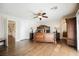 Elegant main bedroom featuring wood floors, a ceiling fan, and natural light at 4384 Grey Spencer Dr, Las Vegas, NV 89141