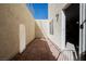 Private outdoor patio provides a cozy retreat, with brick flooring, a wall, and a glimpse of the sky at 4384 Grey Spencer Dr, Las Vegas, NV 89141