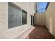 Private patio with brick pavers, access to a window and sliding door to the home at 4384 Grey Spencer Dr, Las Vegas, NV 89141