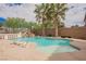 Backyard pool features waterfall, palm trees and beautiful landscaping at 4384 Grey Spencer Dr, Las Vegas, NV 89141