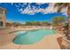 Backyard pool features waterfall, palm trees and beautiful landscaping at 4384 Grey Spencer Dr, Las Vegas, NV 89141