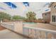 Backyard pool features waterfall, palm trees and beautiful landscaping at 4384 Grey Spencer Dr, Las Vegas, NV 89141