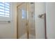 Walk-in shower with glass doors and gold trim complements the updated bathroom design at 4384 Grey Spencer Dr, Las Vegas, NV 89141