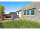 Backyard with grass area, a spa and mature landscaping at 4772 Se Argent Hills Ave, Pahrump, NV 89061